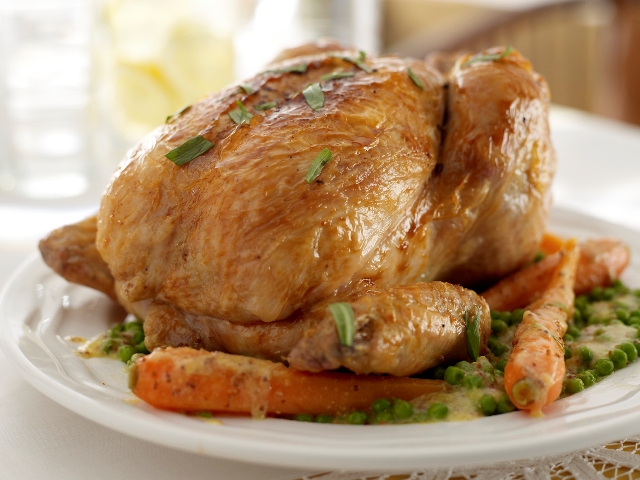 Mustard buttered chicken with tarragon, peas and carrots