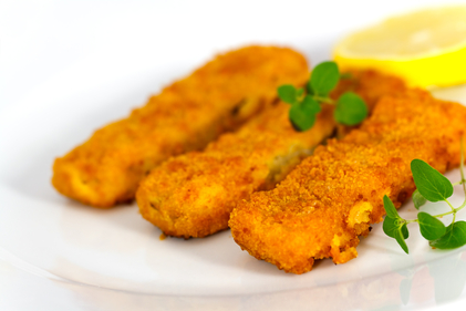 Homemade fish fingers with sweet potato cubes