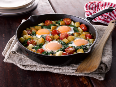 Sauté potatoes with spinach and eggs