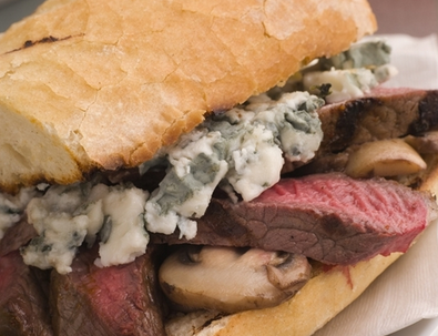 Toasted baguette minute steak with a mushroom and blue cheese sauce