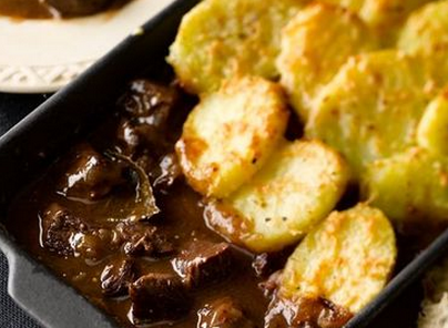 Beef casserole with sliced potato topping
