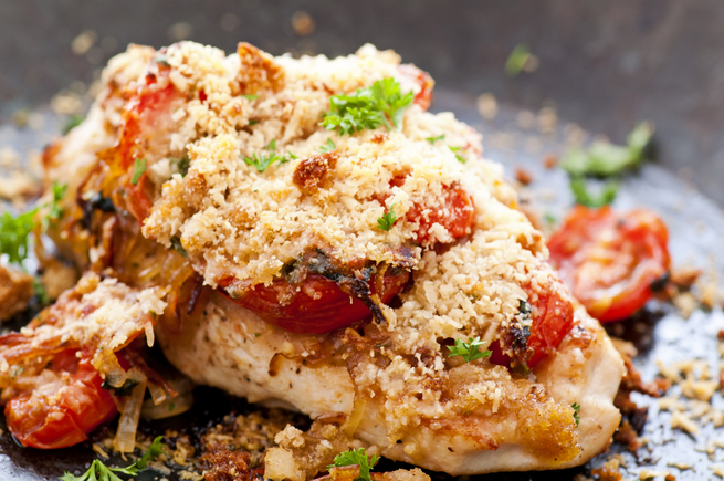 Baked chicken and goats cheese with cherry tomatoes