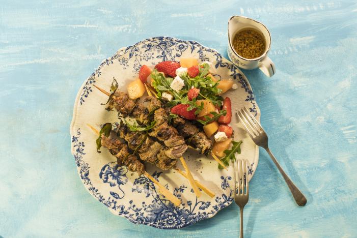 Lamb skewers with rocket melon strawberry salad