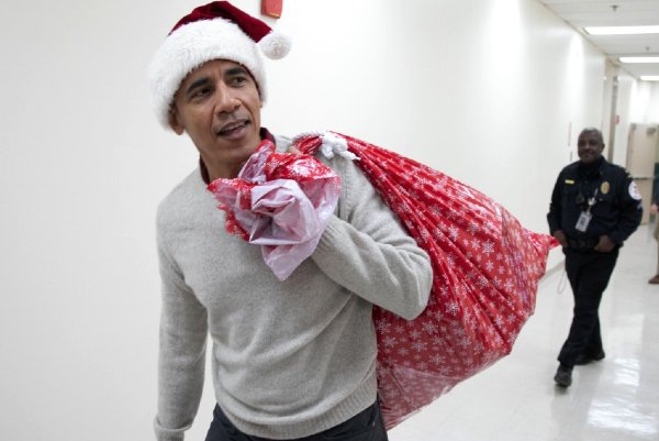 Santa comes early: Obama brings presents to children in hospital