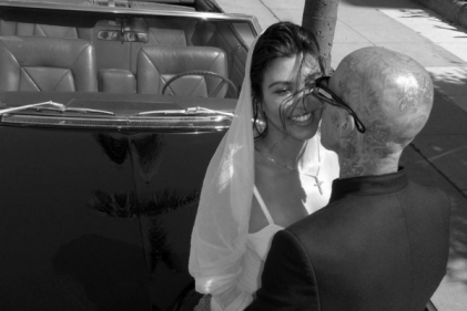Kourtney Kardashian shares first official photos from her & Travis’ intimate wedding